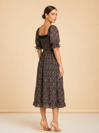 Pink & black floral dress model_over_shoulder
